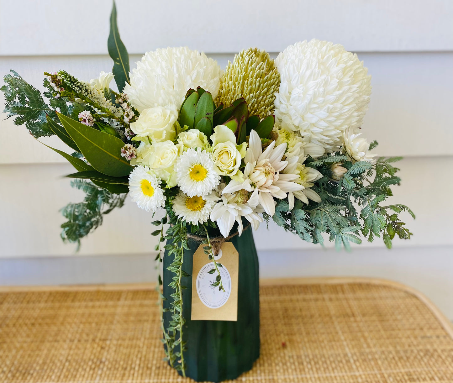 Mixed posy in glass vase in