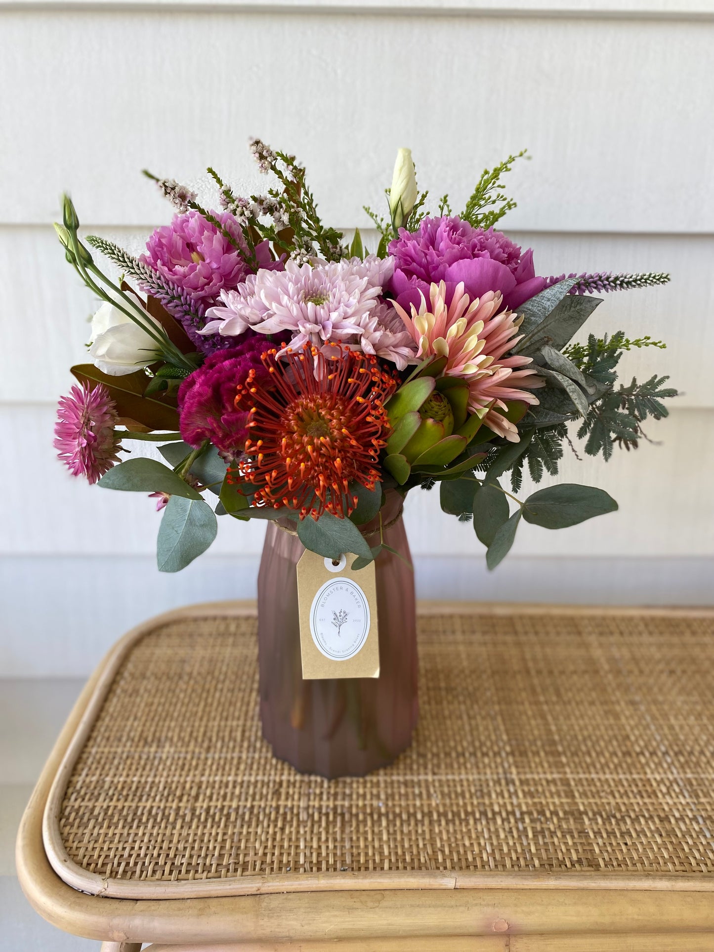 Mixed posy in glass vase in