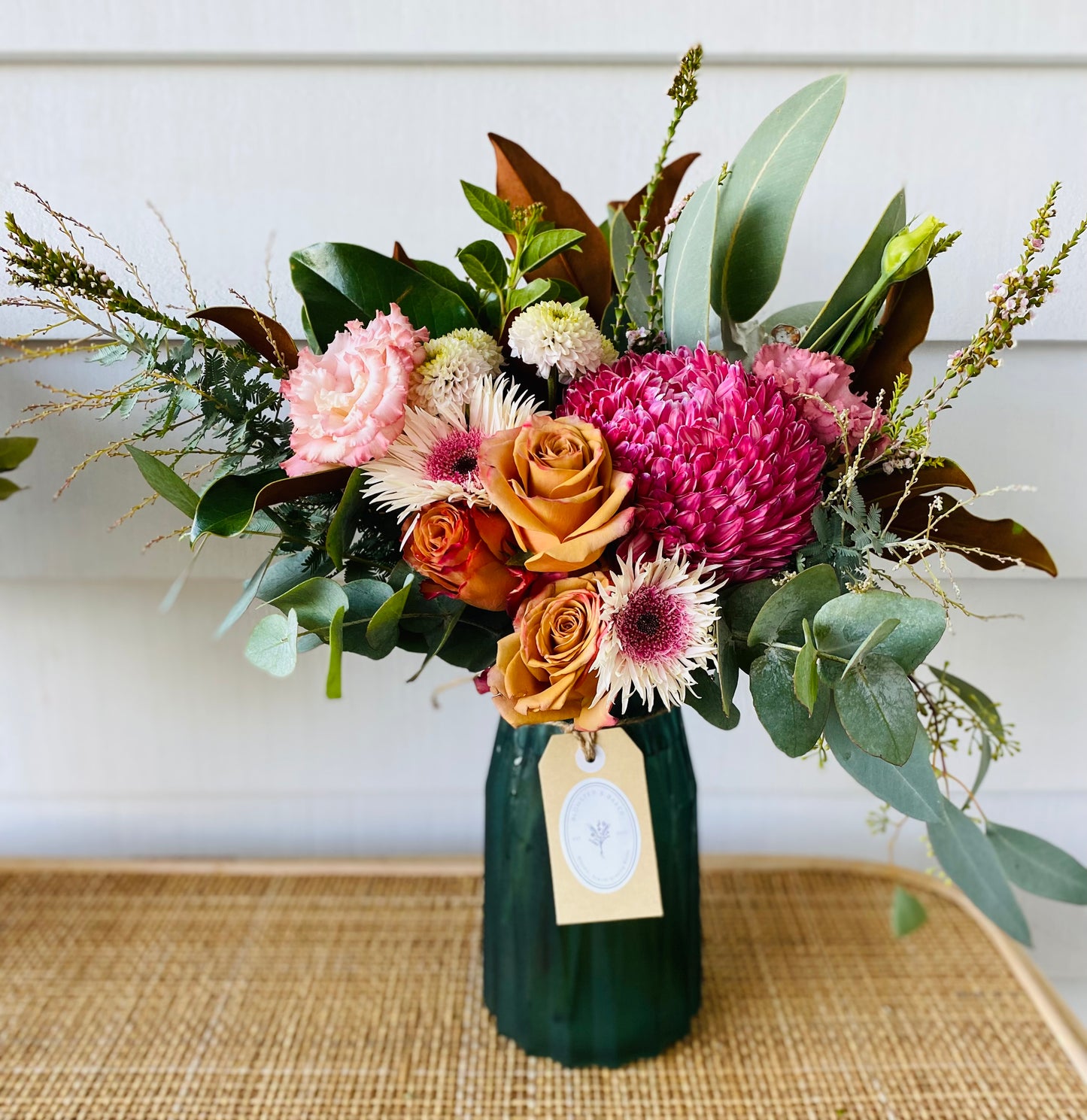 Mixed posy in glass vase in