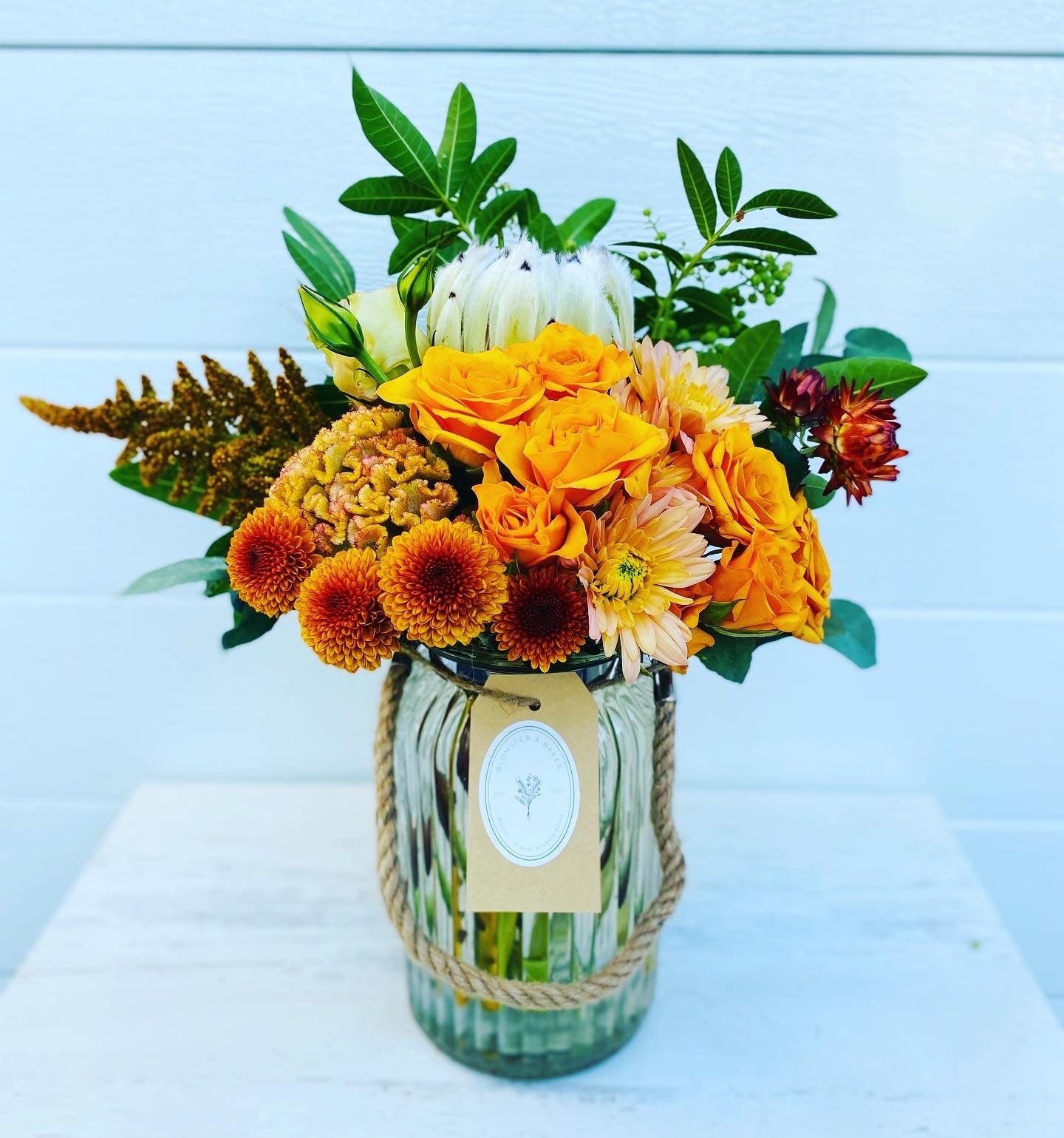 Mixed posy in glass vase in