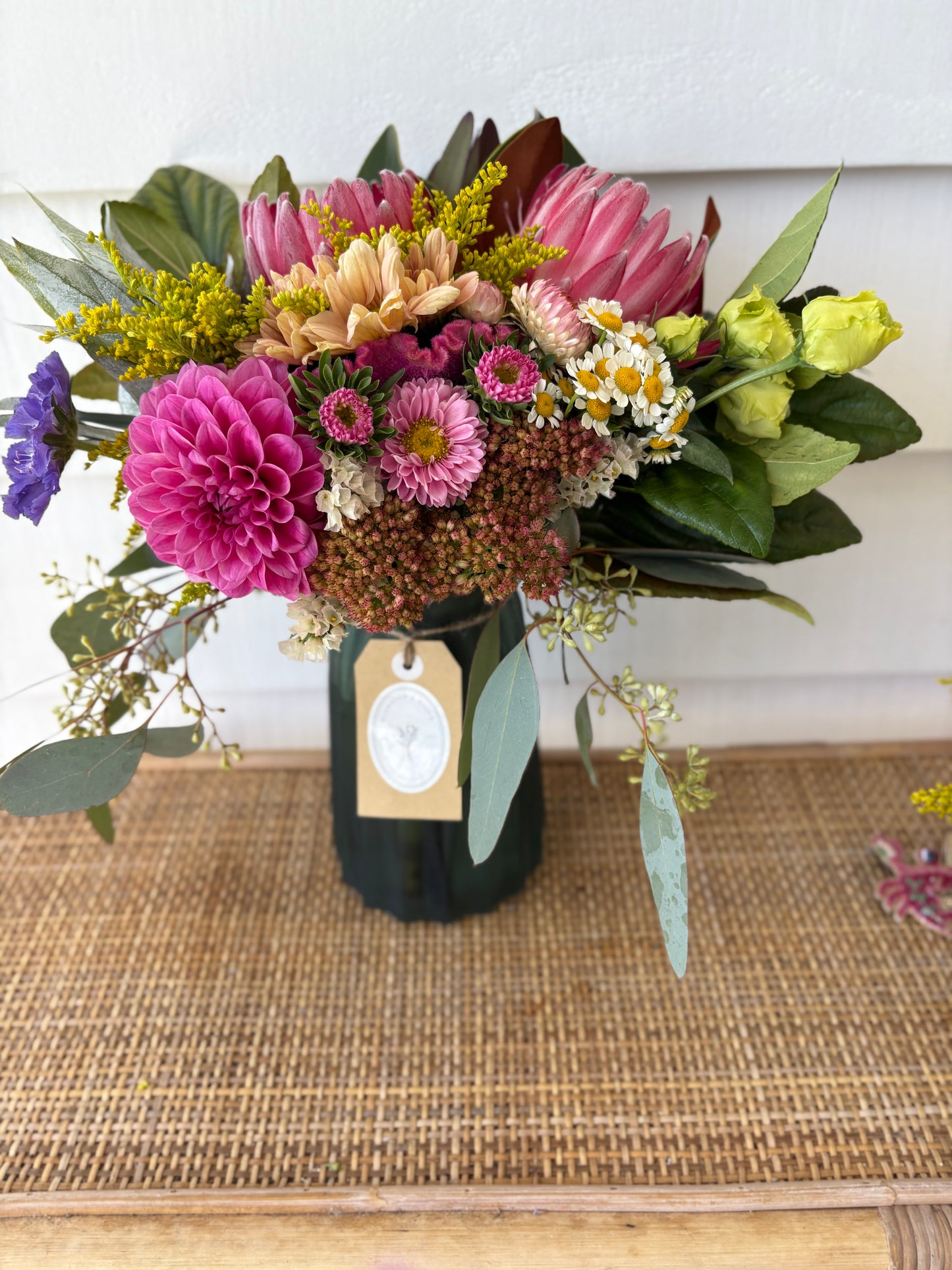 Mixed posy in glass vase in