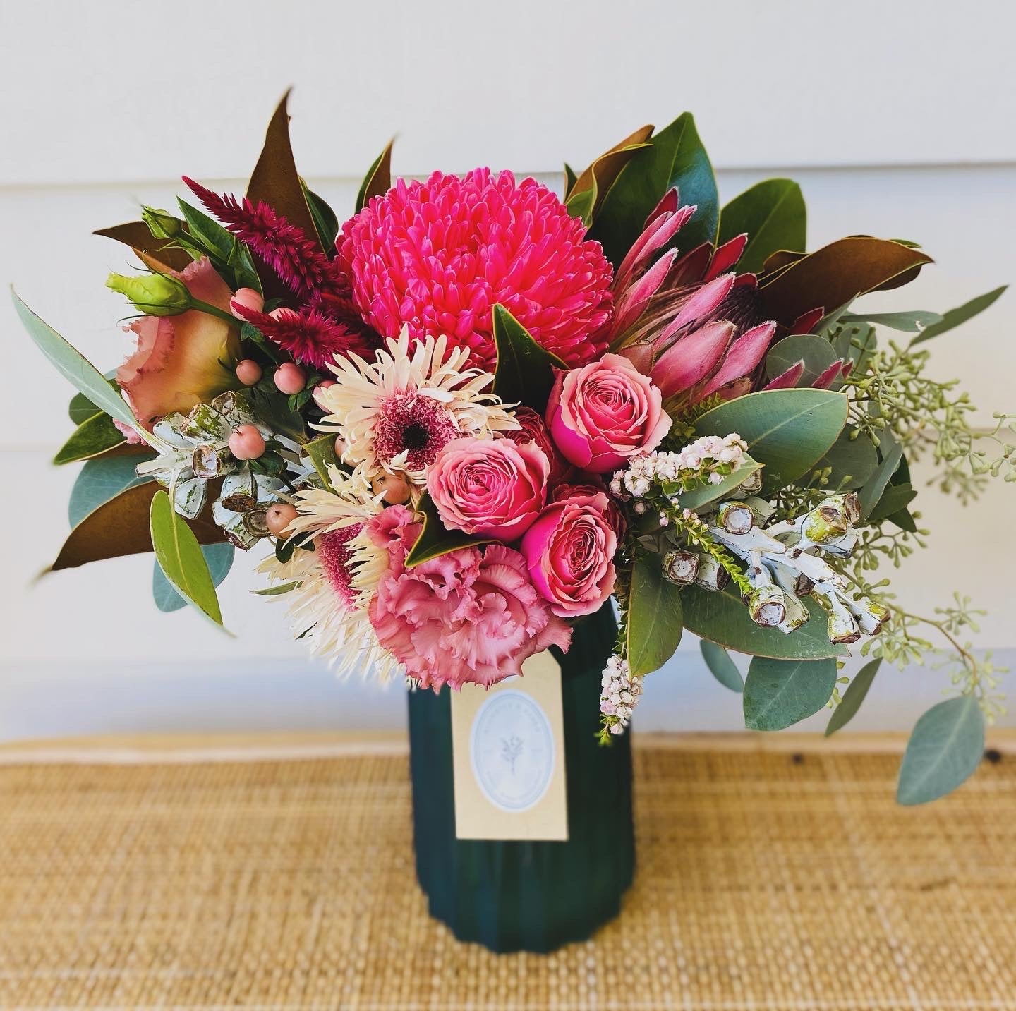 Mixed posy in glass vase in
