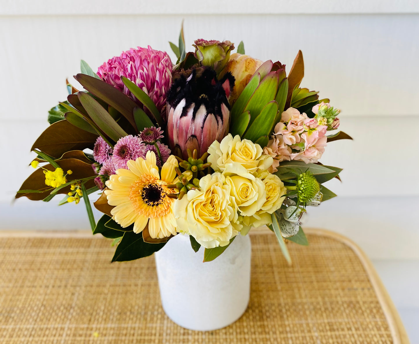 Mixed posy in glass vase in