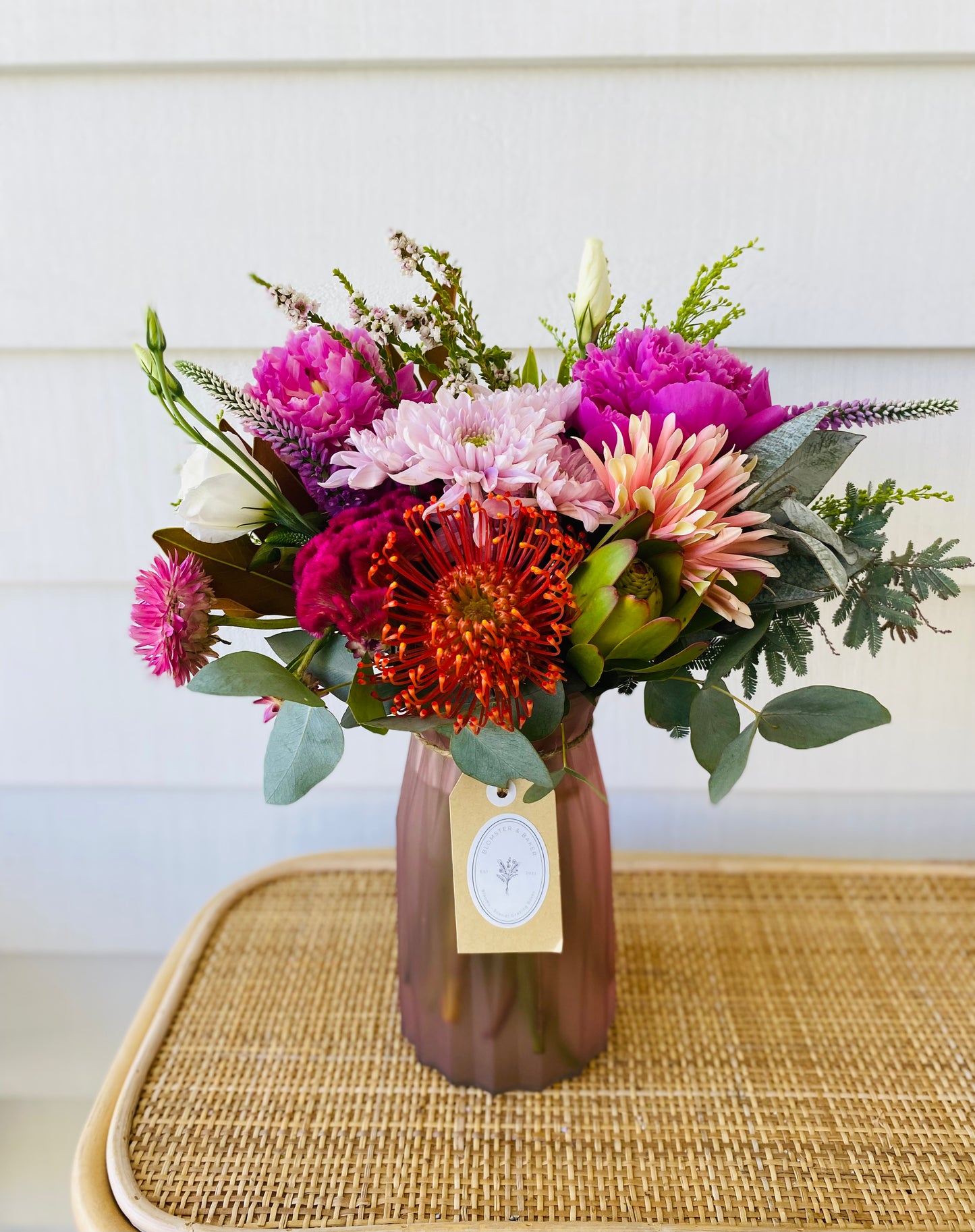Mixed posy in glass vase in