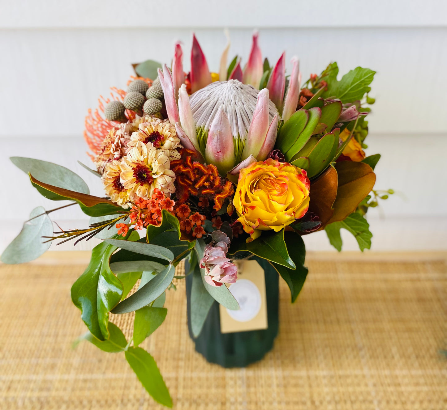 Mixed posy in glass vase in