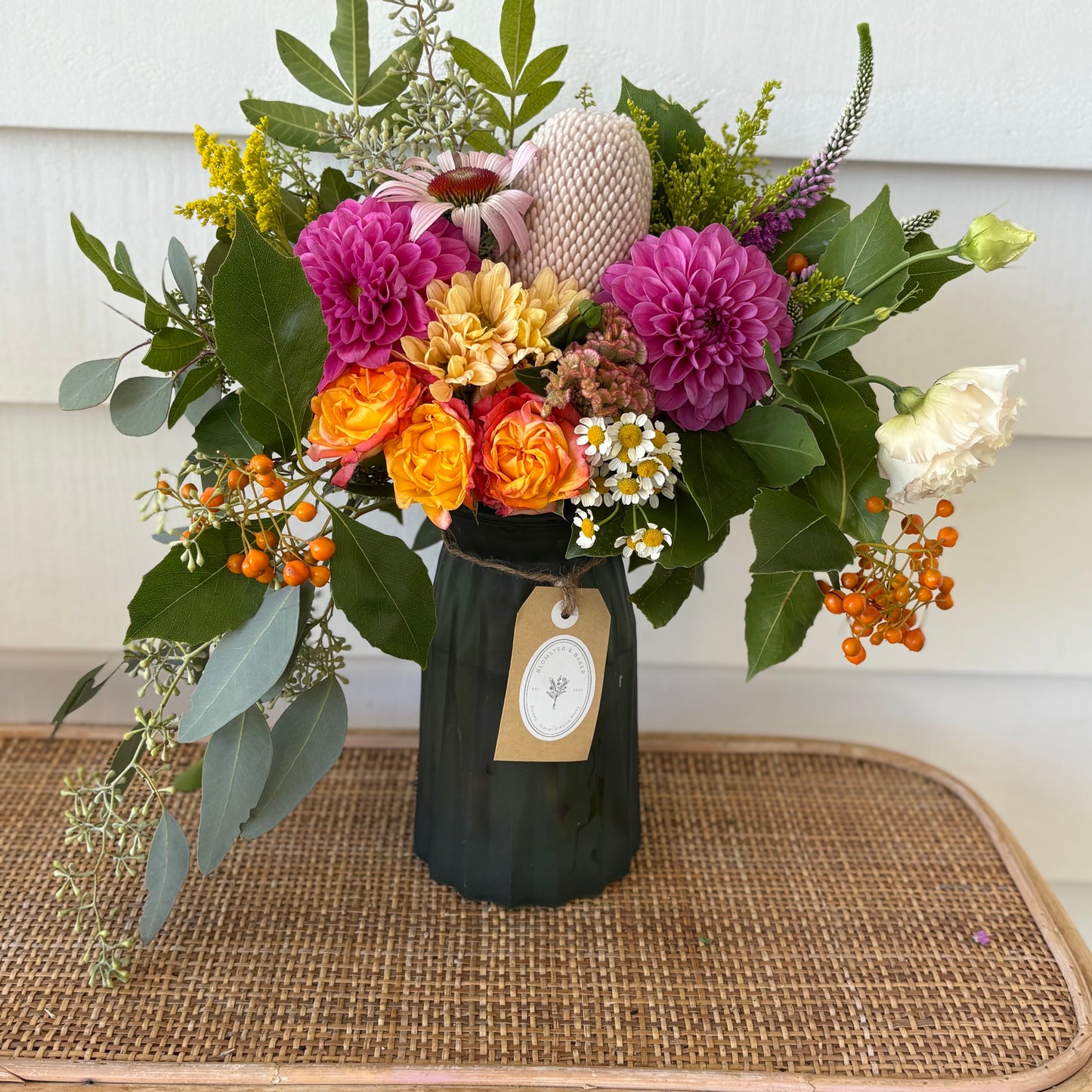 Mixed posy in glass vase in
