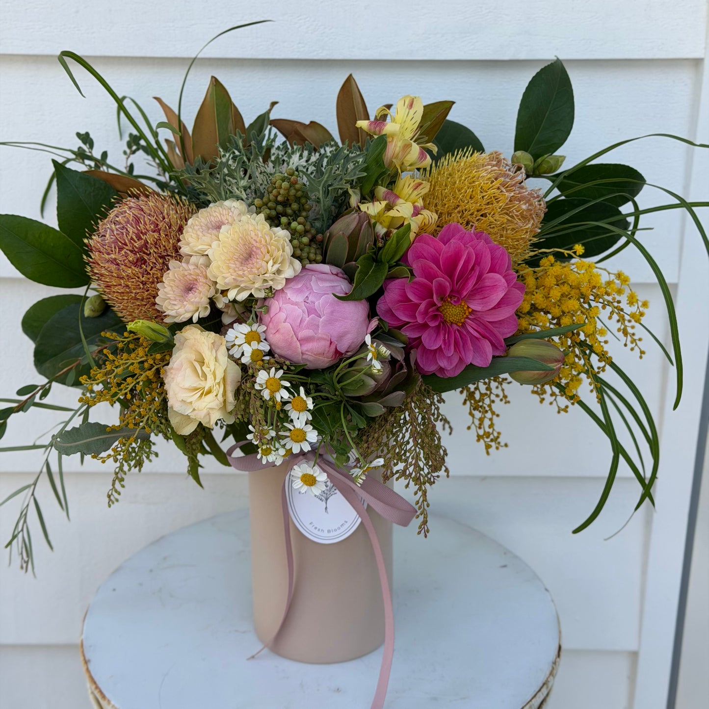 Mixed posy in glass vase in