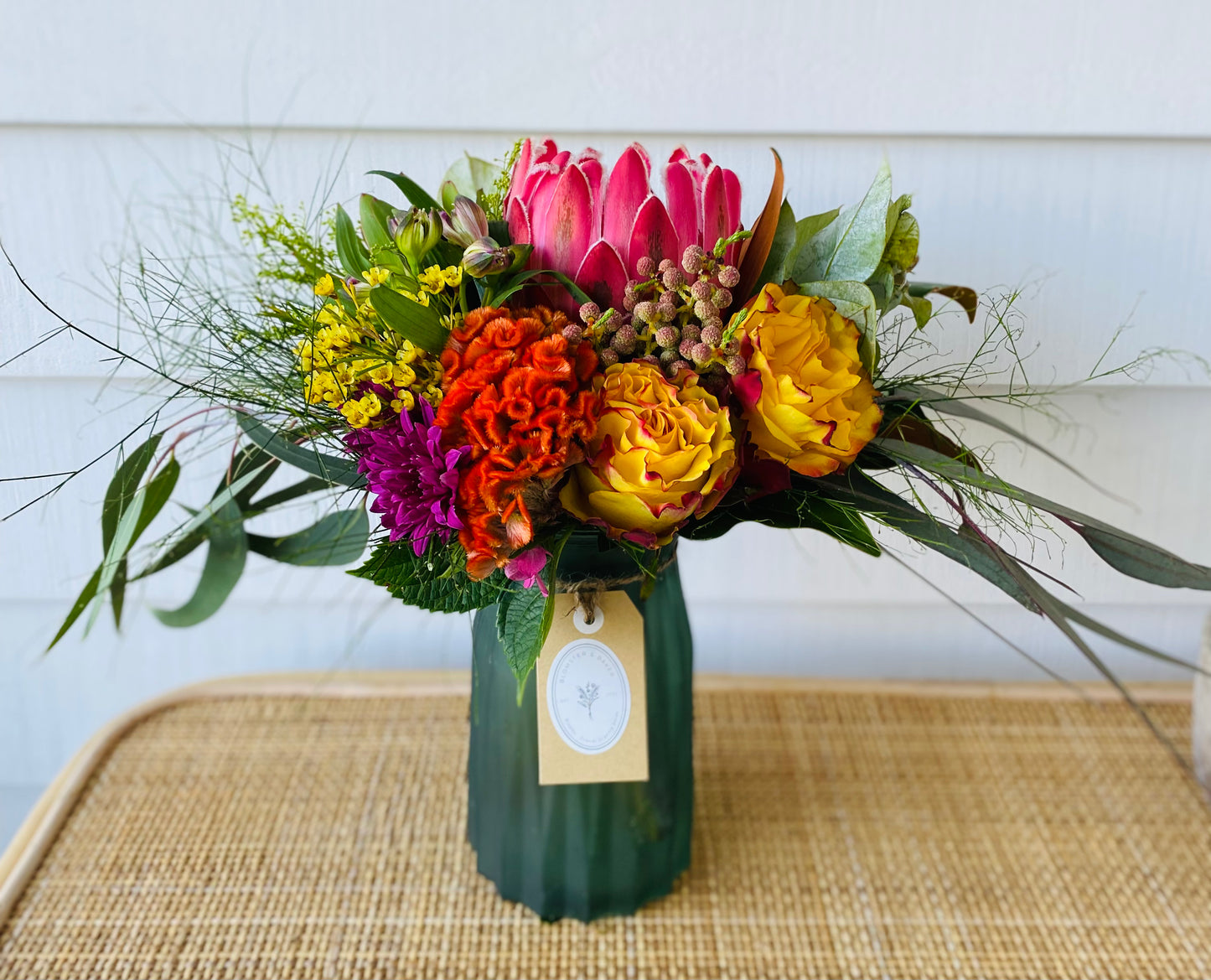 Mixed posy in glass vase in