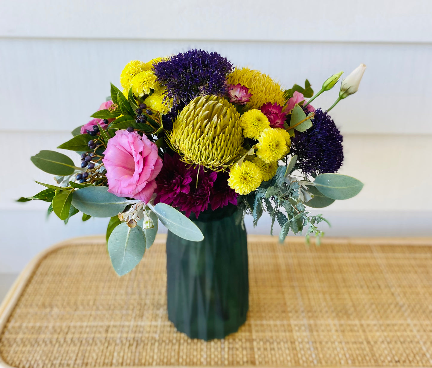 Mixed posy in glass vase in