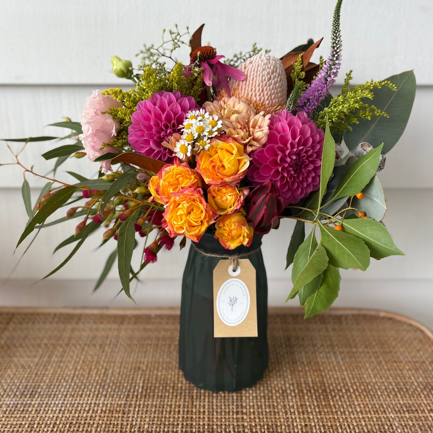 Mixed posy in glass vase in