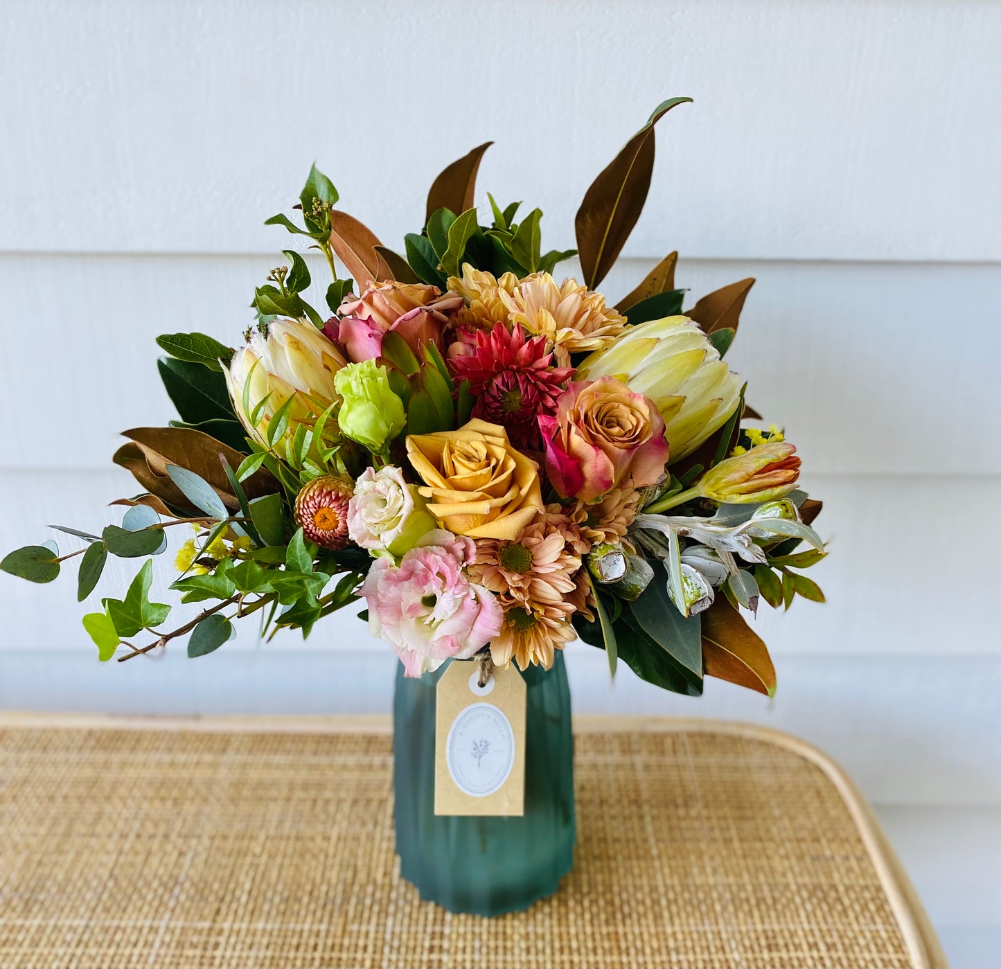 Mixed posy in glass vase in
