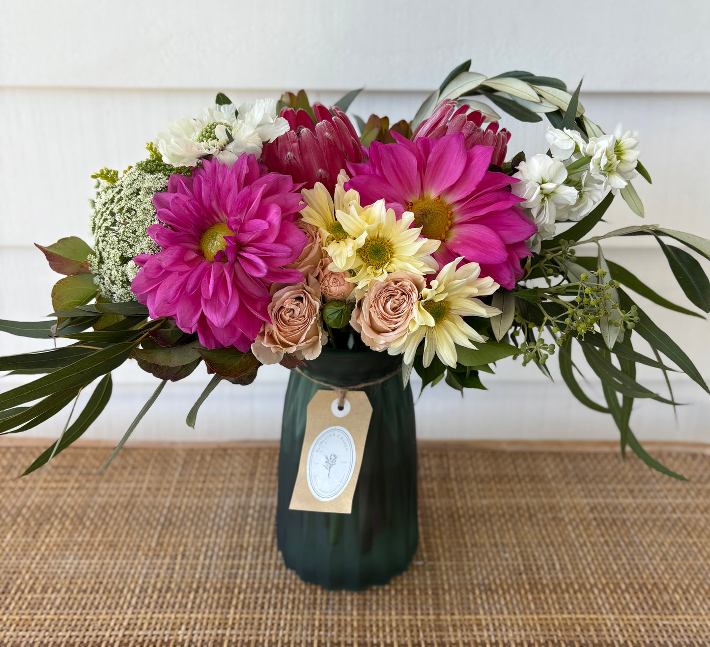 Mixed posy in glass vase in