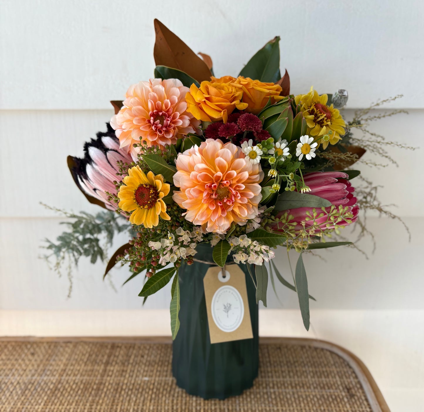 Mixed posy in glass vase in