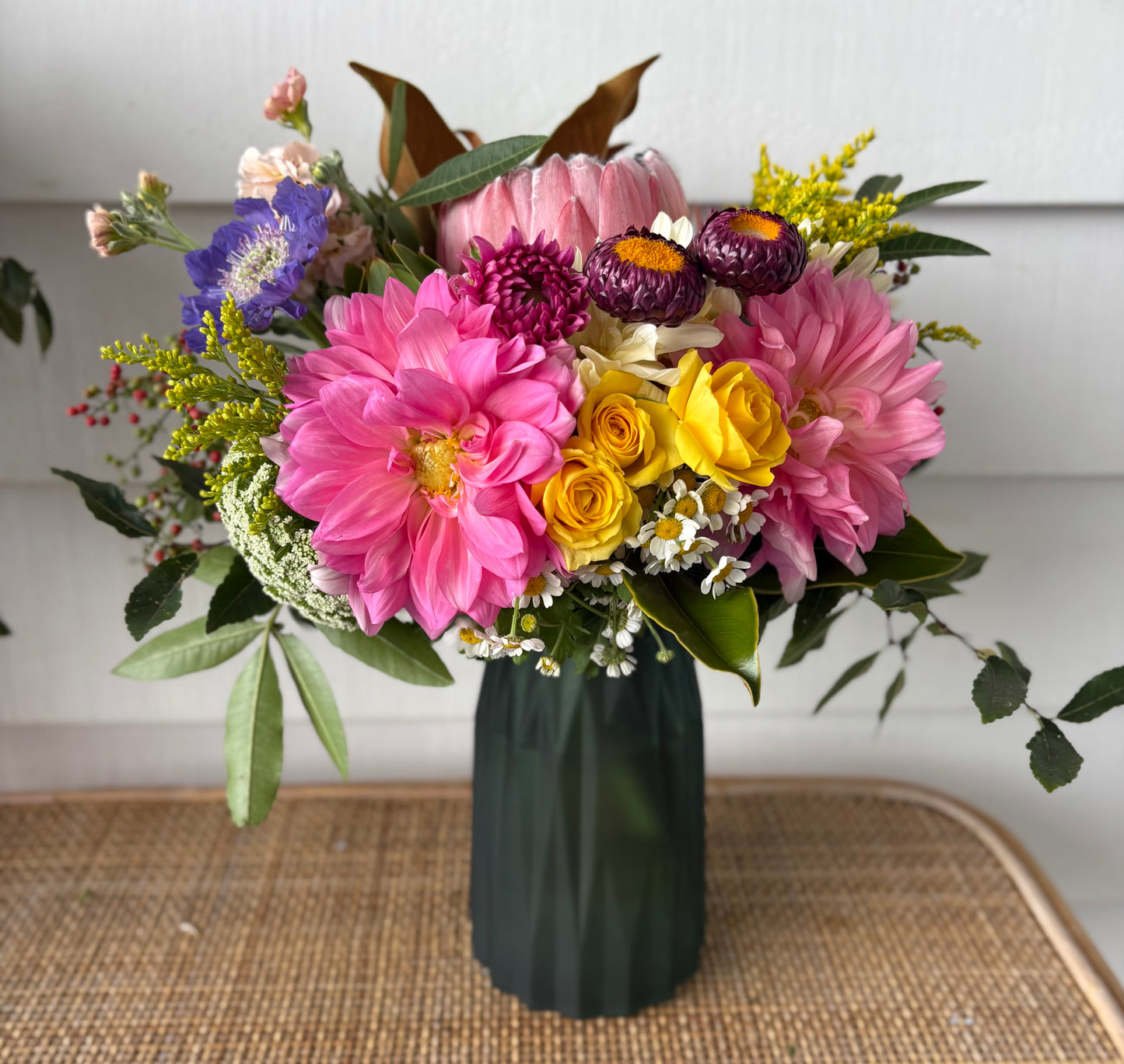 Mixed posy in glass vase in