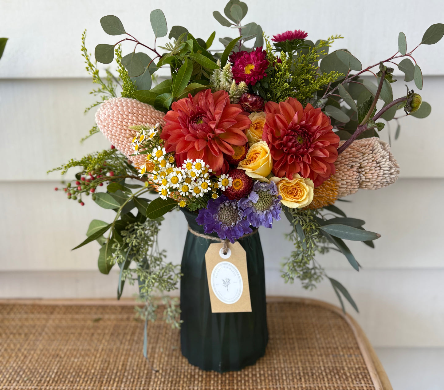 Mixed posy in glass vase in