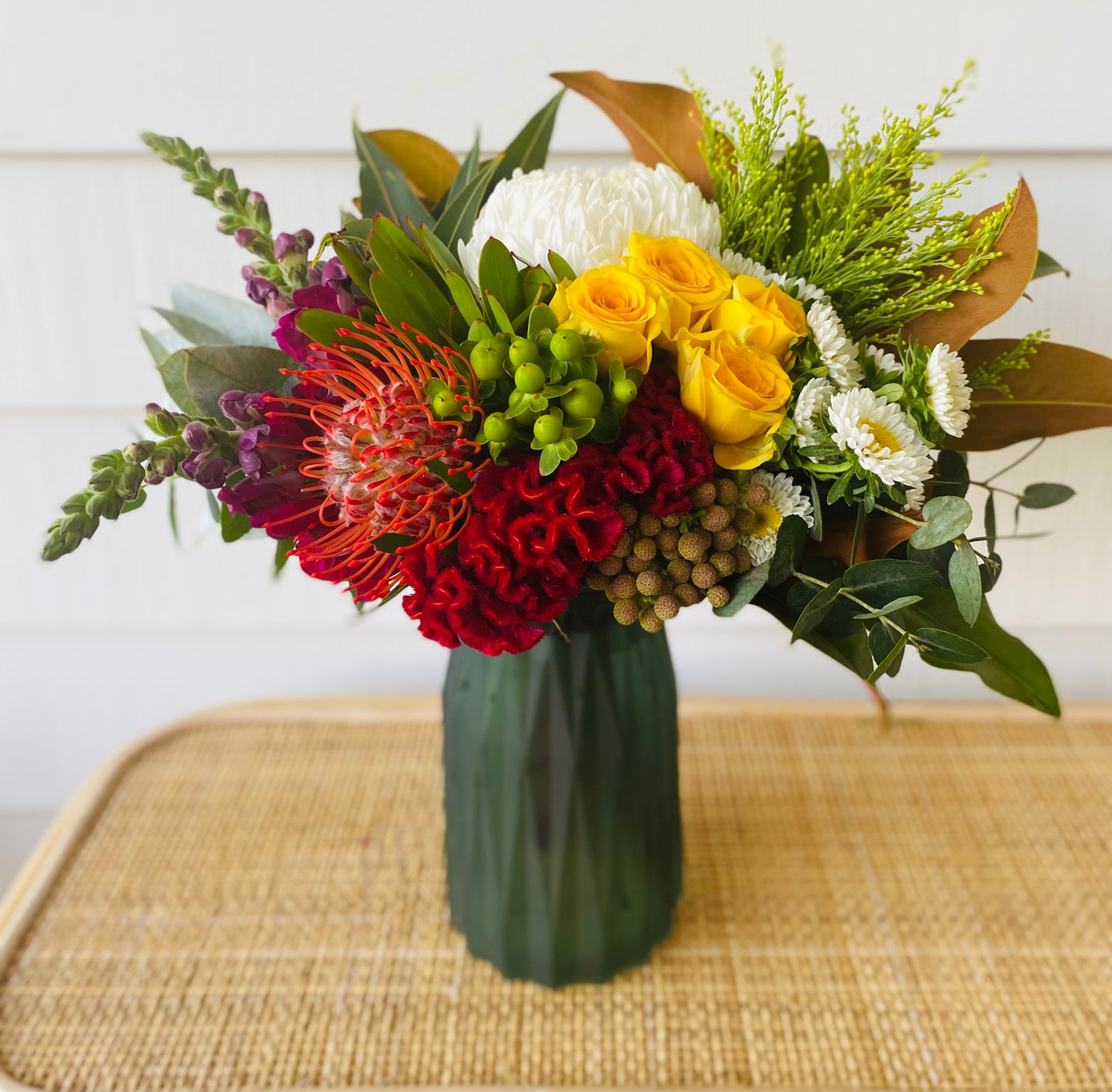 Mixed posy in glass vase in
