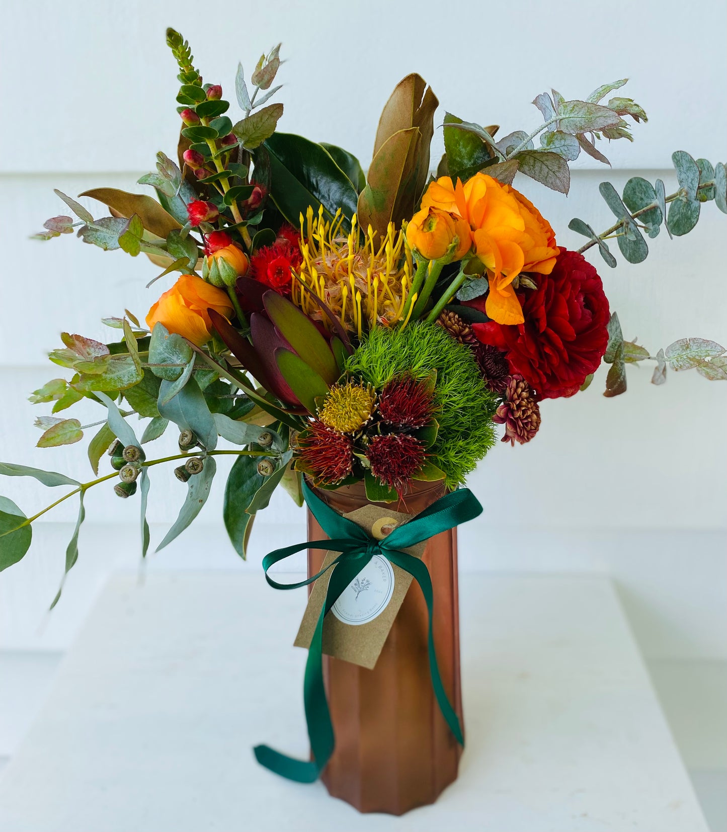 Mixed posy in glass vase in