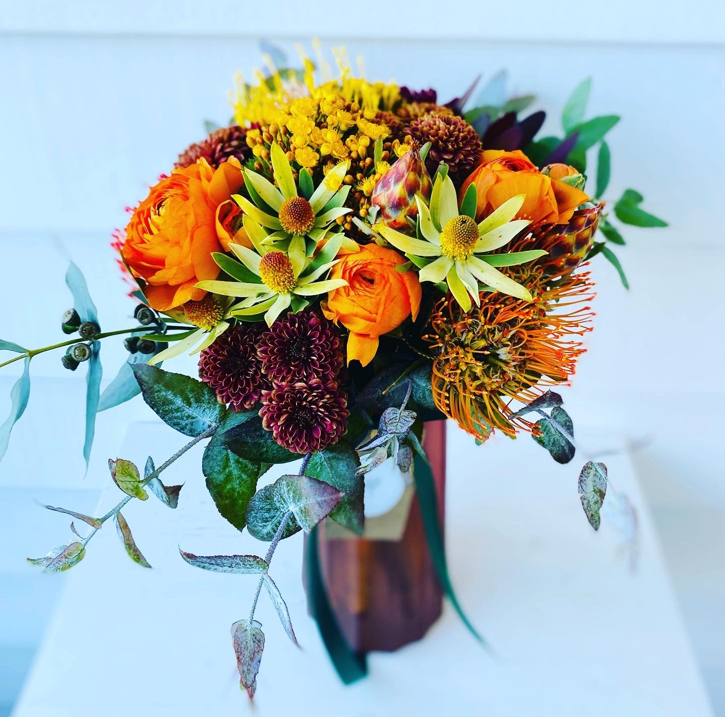 Mixed posy in glass vase in