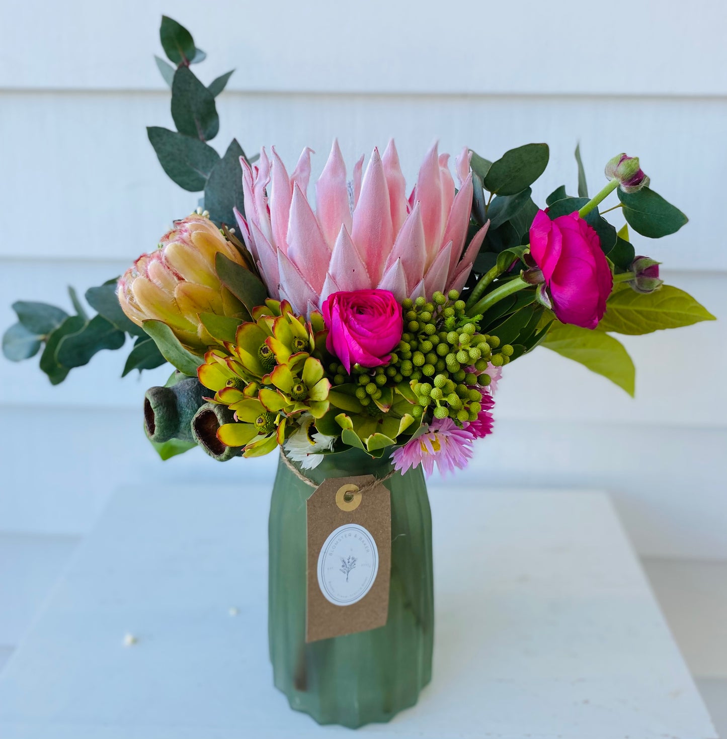 Mixed posy in glass vase in