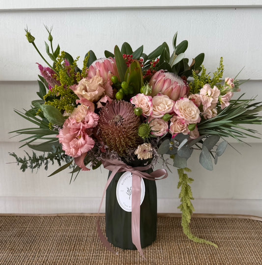 Mixed posy in glass vase in