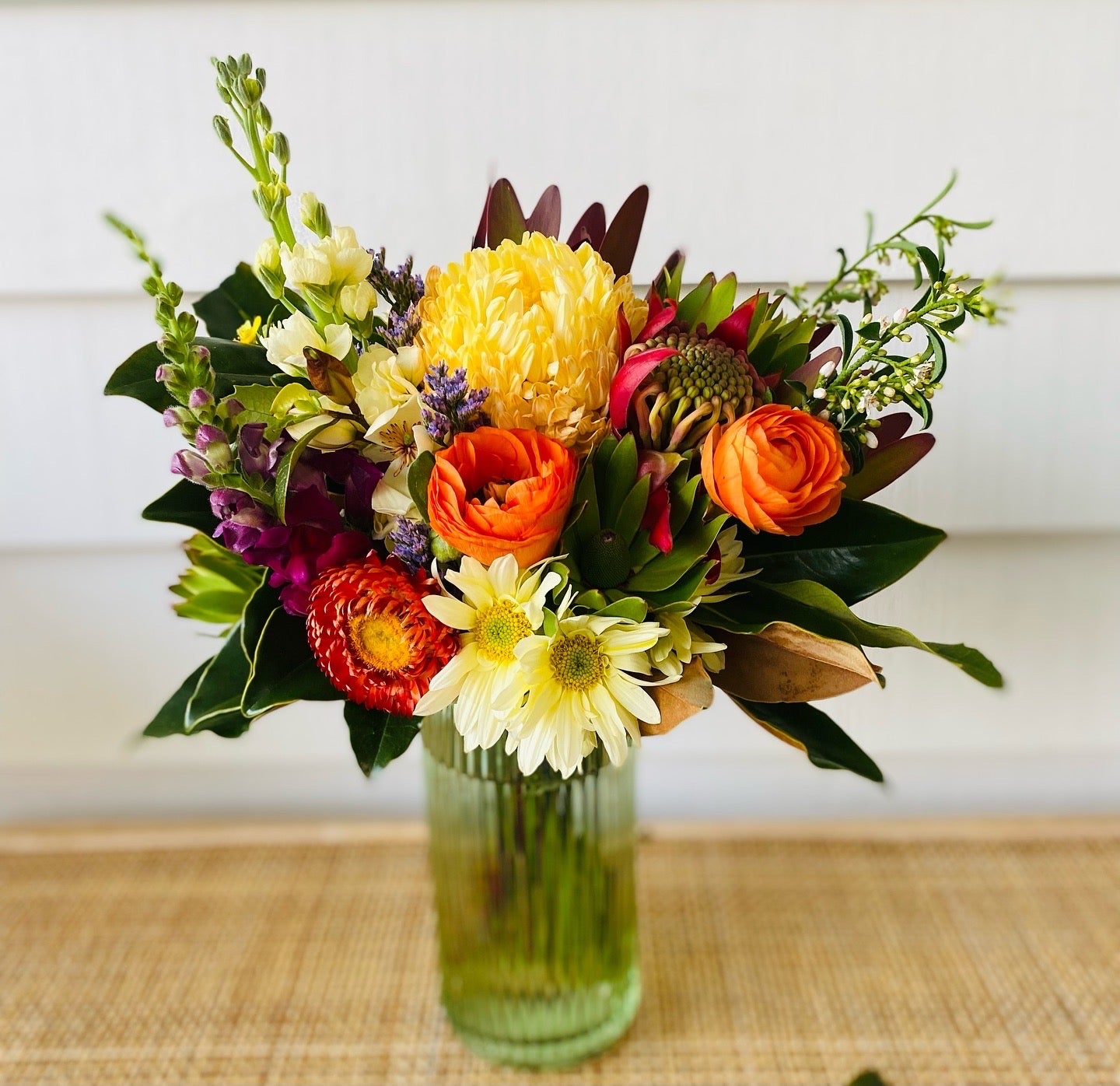 Mixed posy in glass vase in