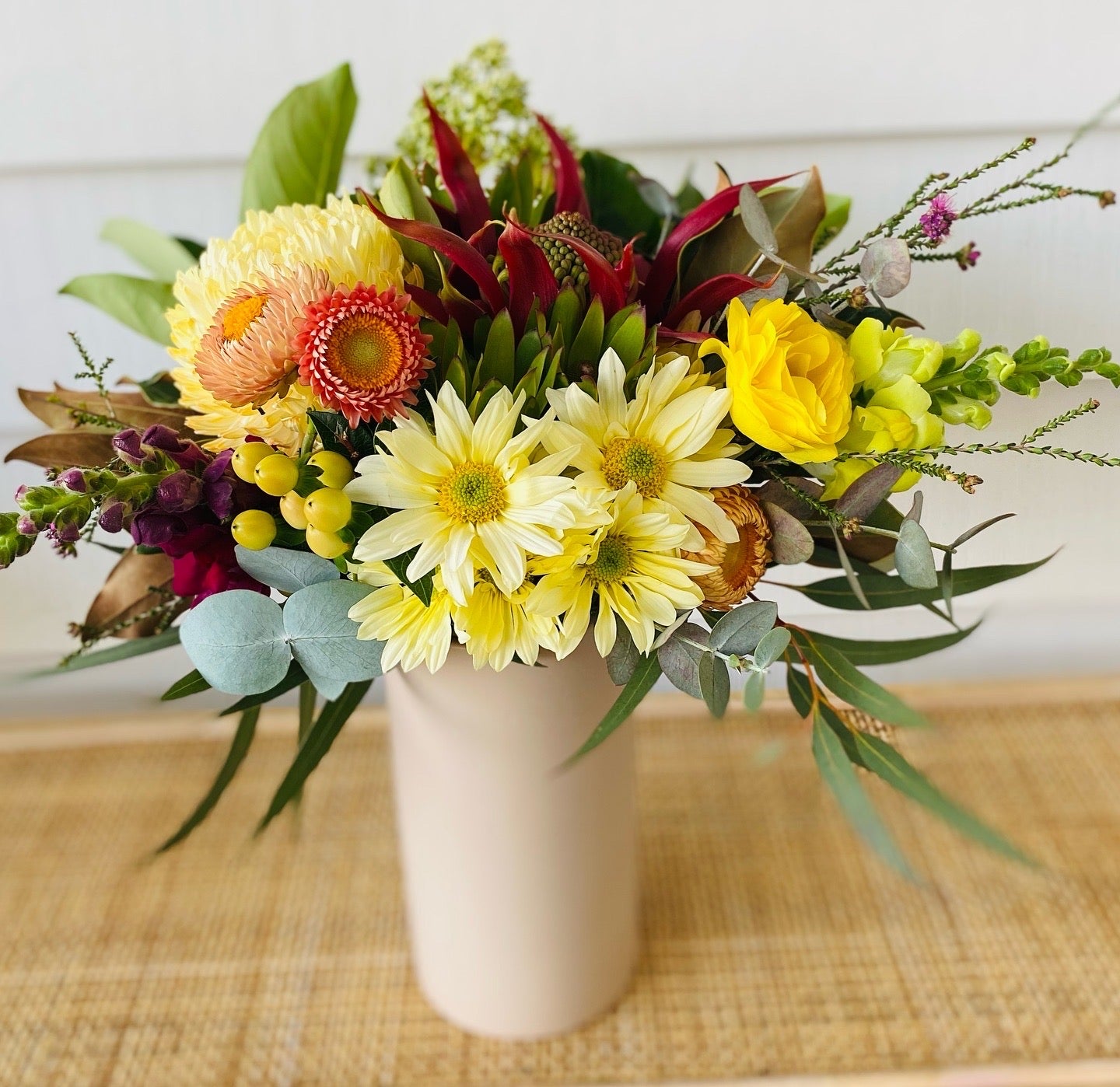 Mixed posy in glass vase in