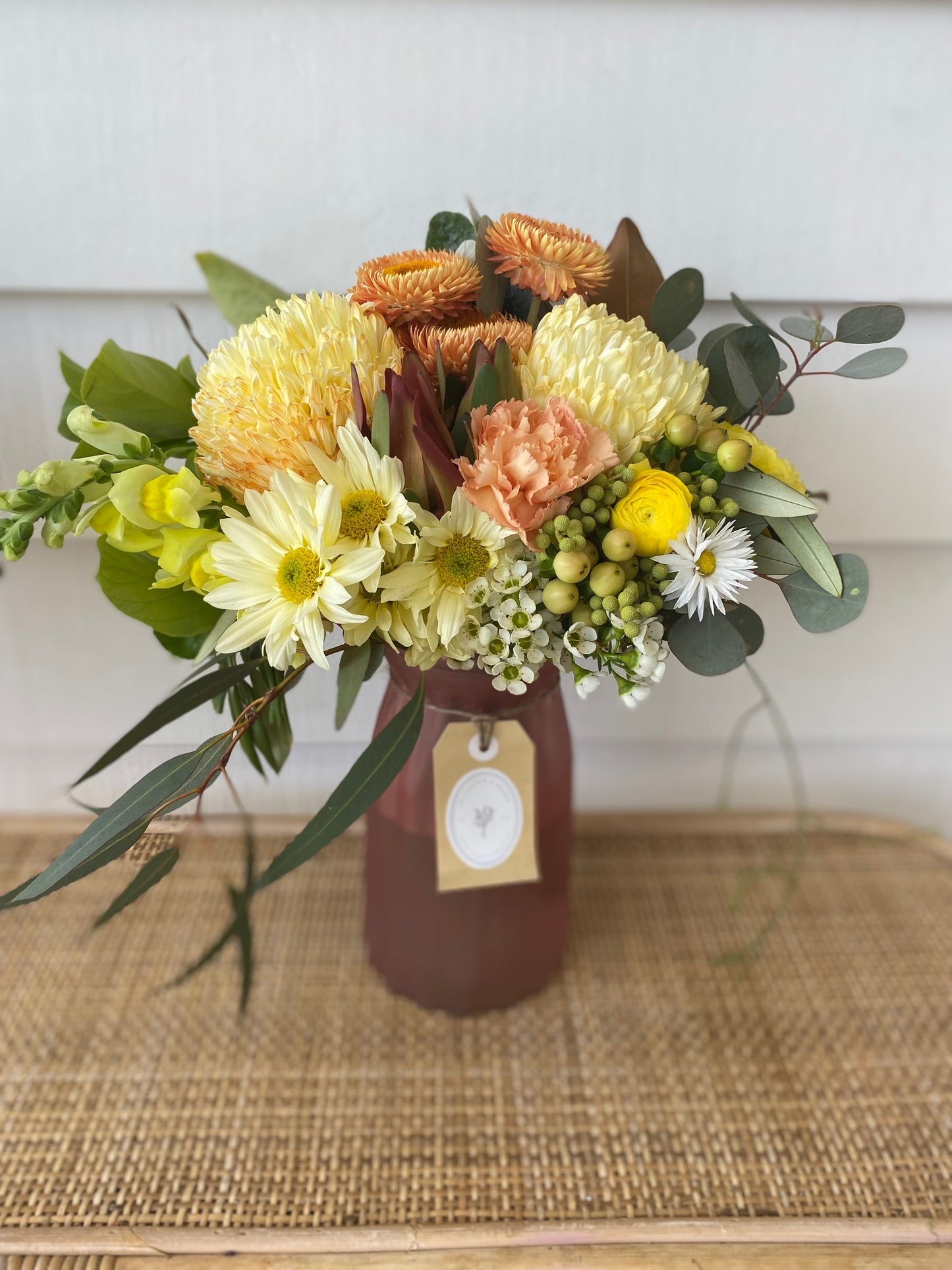 Mixed posy in glass vase in