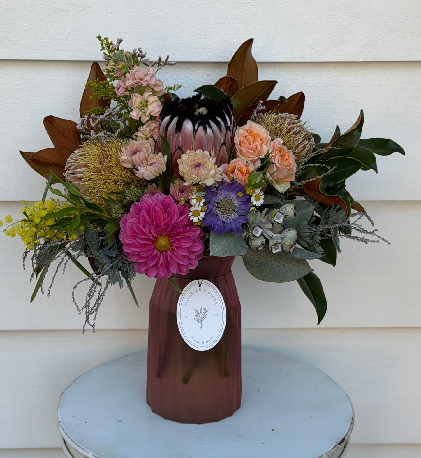 Mixed posy in glass vase in