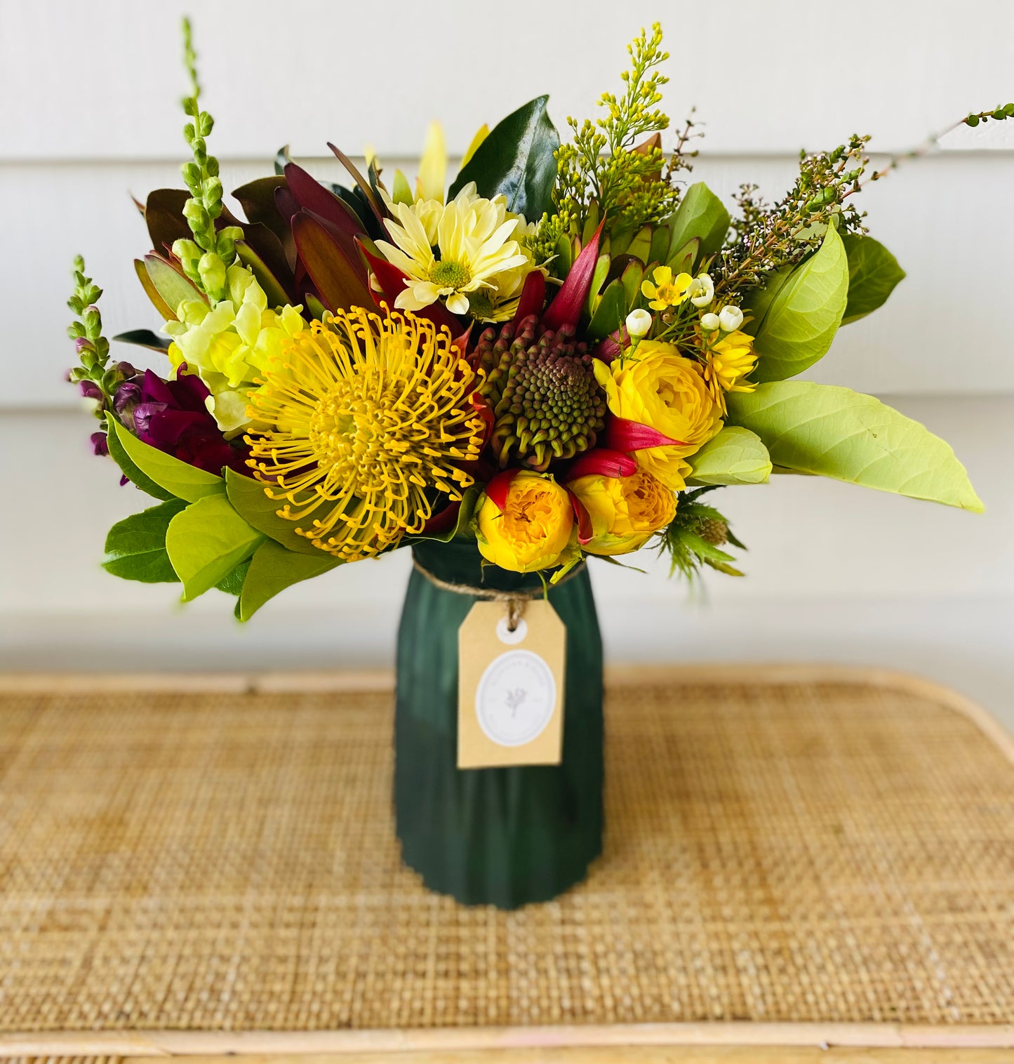 Mixed posy in glass vase in