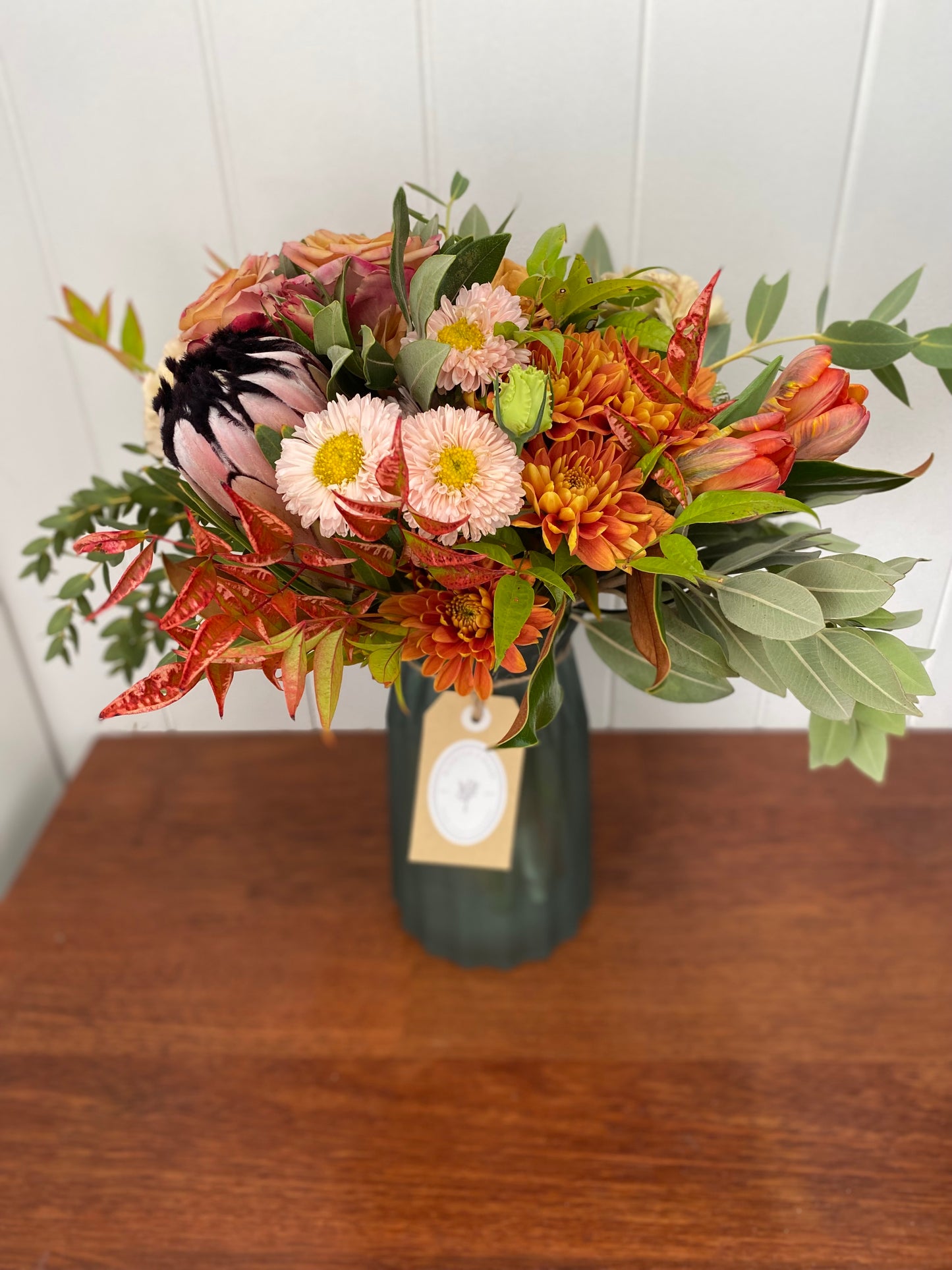 Mother’s Day mixed posy in a vase .