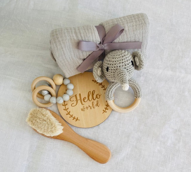 Handmade Elephant Crochet Rattle Knitted, Newborn Baby Gift Set together with a small posy in a vase.