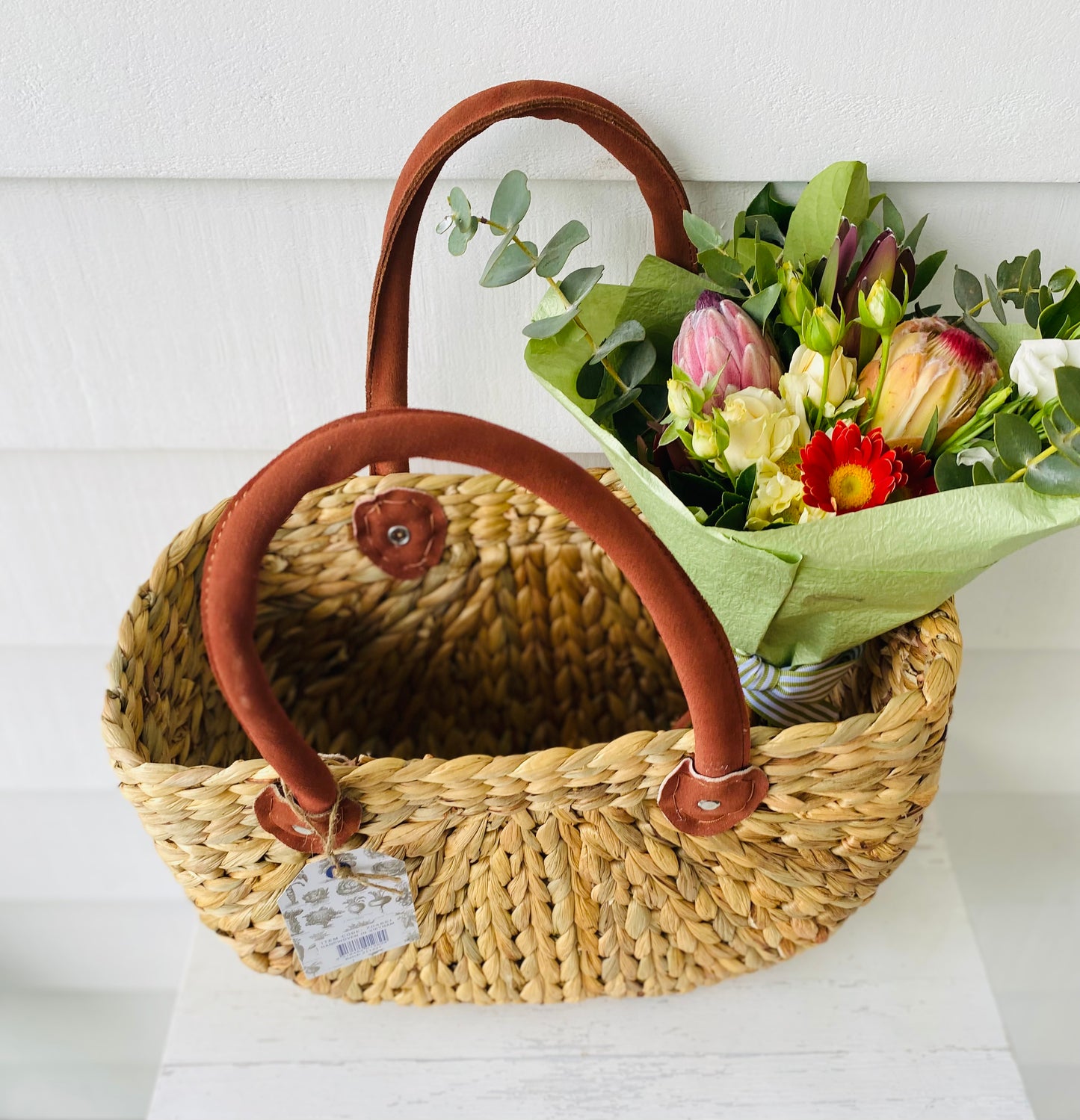 A mixed posy with a large Rober Gordon shopping bag